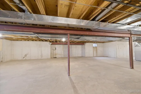 a view of empty room with wooden ceiling