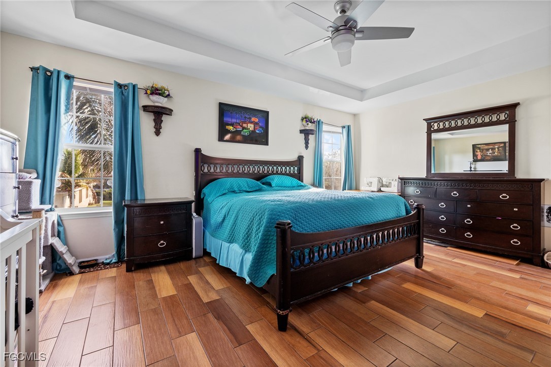 8657 Sumner Avenue Fort Myers, FL 33908 - Photo 16 of 29 a bedroom with a bed and a dresser