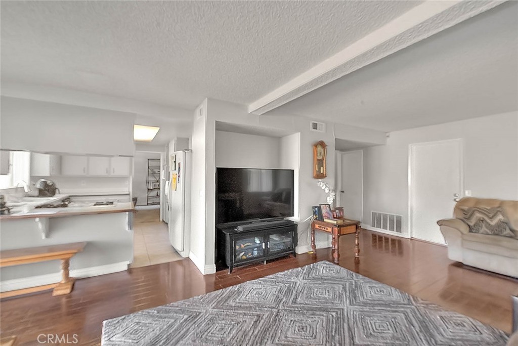 8 Tanglewood Drive Phillips Ranch, CA 91766 - Photo 15 of 71 a living room with furniture and a flat screen tv
