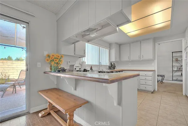 a kitchen with a sink cabinets and window