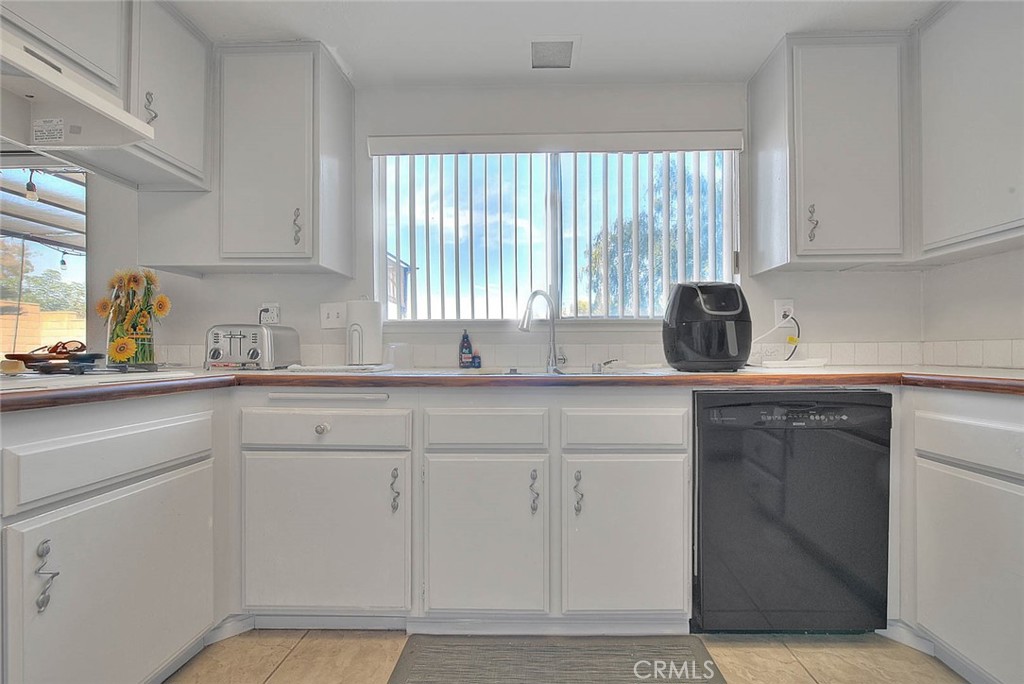 8 Tanglewood Drive Phillips Ranch, CA 91766 - Photo 19 of 71 a kitchen with a sink cabinets and window