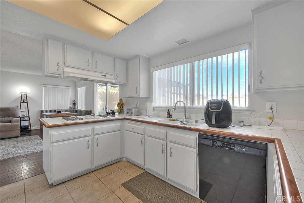 8 Tanglewood Drive Phillips Ranch, CA 91766 - Photo 20 of 71 a kitchen with a sink stove and cabinets
