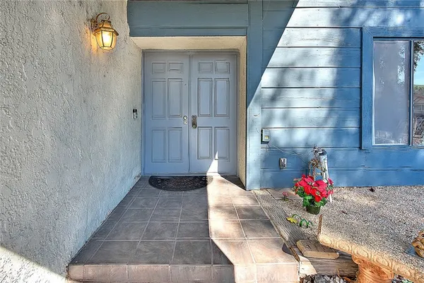 a view of staircase and living room with windows