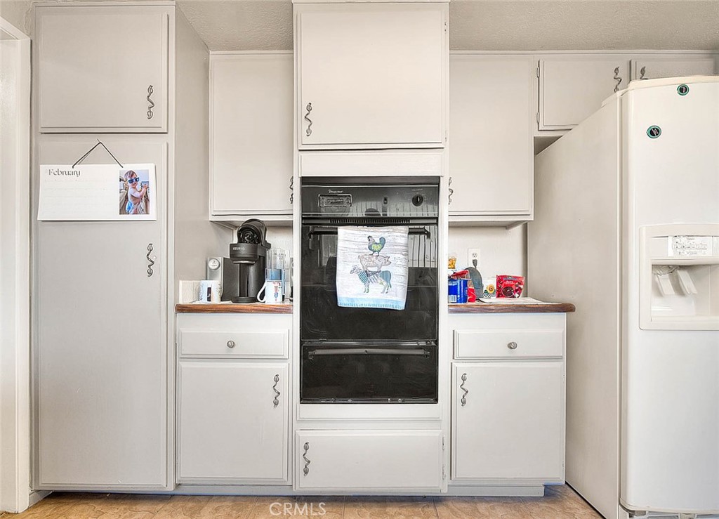 8 Tanglewood Drive Phillips Ranch, CA 91766 - Photo 22 of 71 a kitchen with stainless steel appliances a refrigerator sink and cabinets