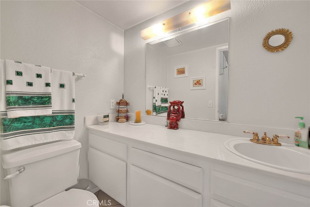 8 Tanglewood Drive Phillips Ranch, CA 91766 - Photo 23 of 71 a bathroom with a sink and a mirror