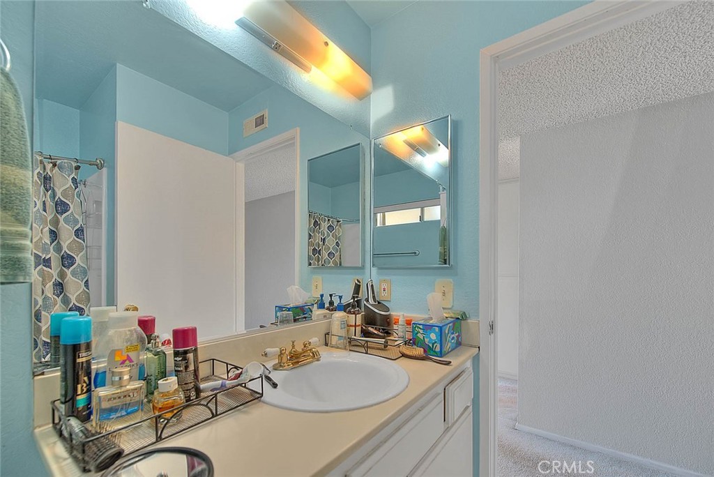 8 Tanglewood Drive Phillips Ranch, CA 91766 - Photo 28 of 71 a bathroom with a sink vanity mirror and a shower