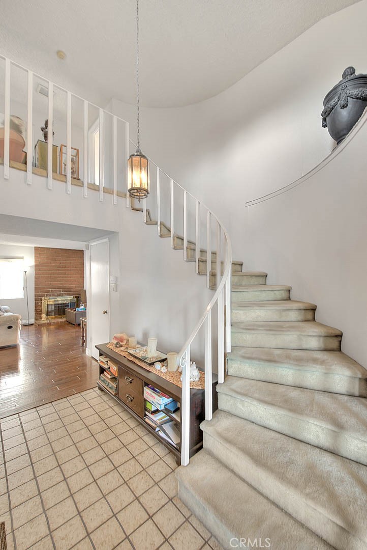 8 Tanglewood Drive Phillips Ranch, CA 91766 - Photo 3 of 71 a view of staircase and living room with windows