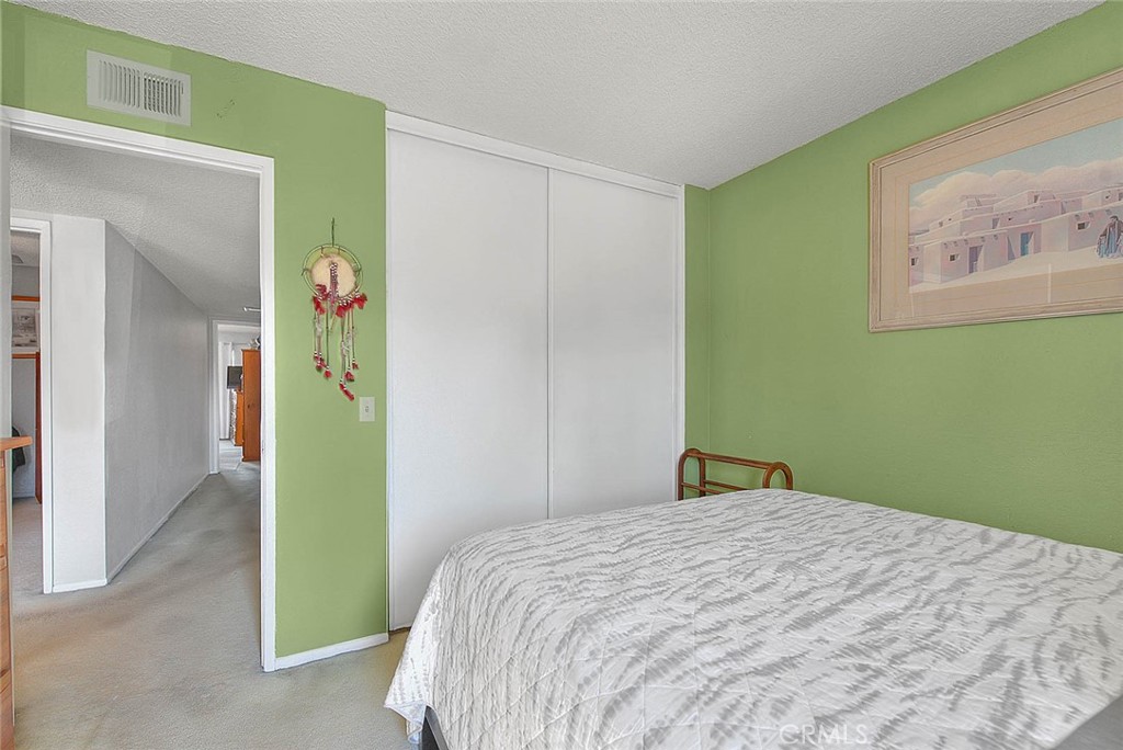 8 Tanglewood Drive Phillips Ranch, CA 91766 - Photo 33 of 71 a bedroom with a bed and a window