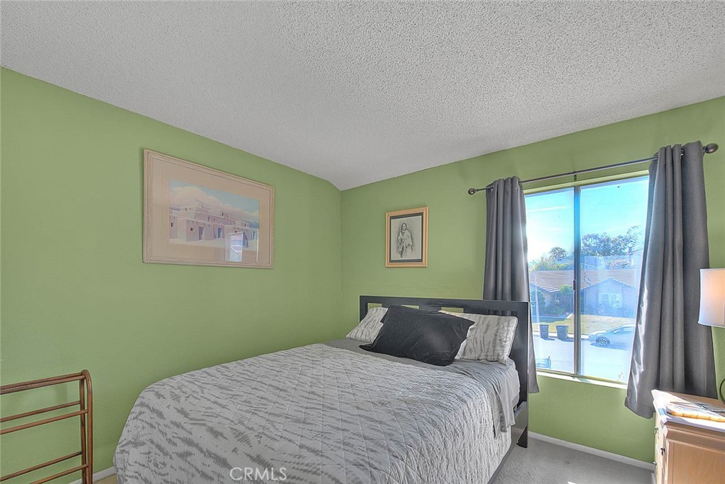 8 Tanglewood Drive Phillips Ranch, CA 91766 - Photo 34 of 71 a bedroom with a bed and a painting on the wall