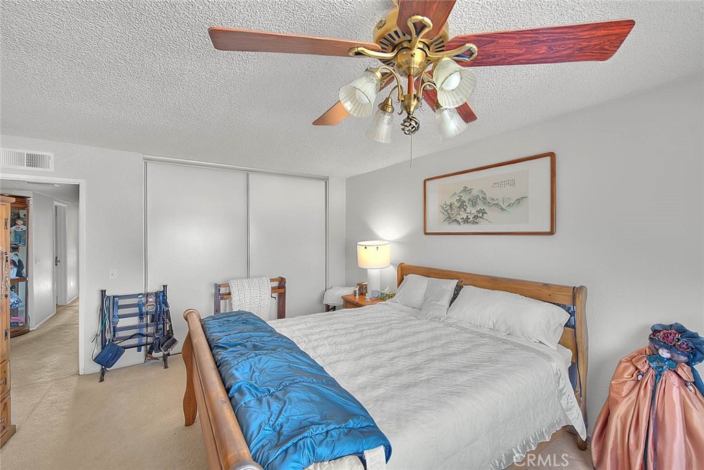 8 Tanglewood Drive Phillips Ranch, CA 91766 - Photo 37 of 71 a bedroom with a bed and a chandelier