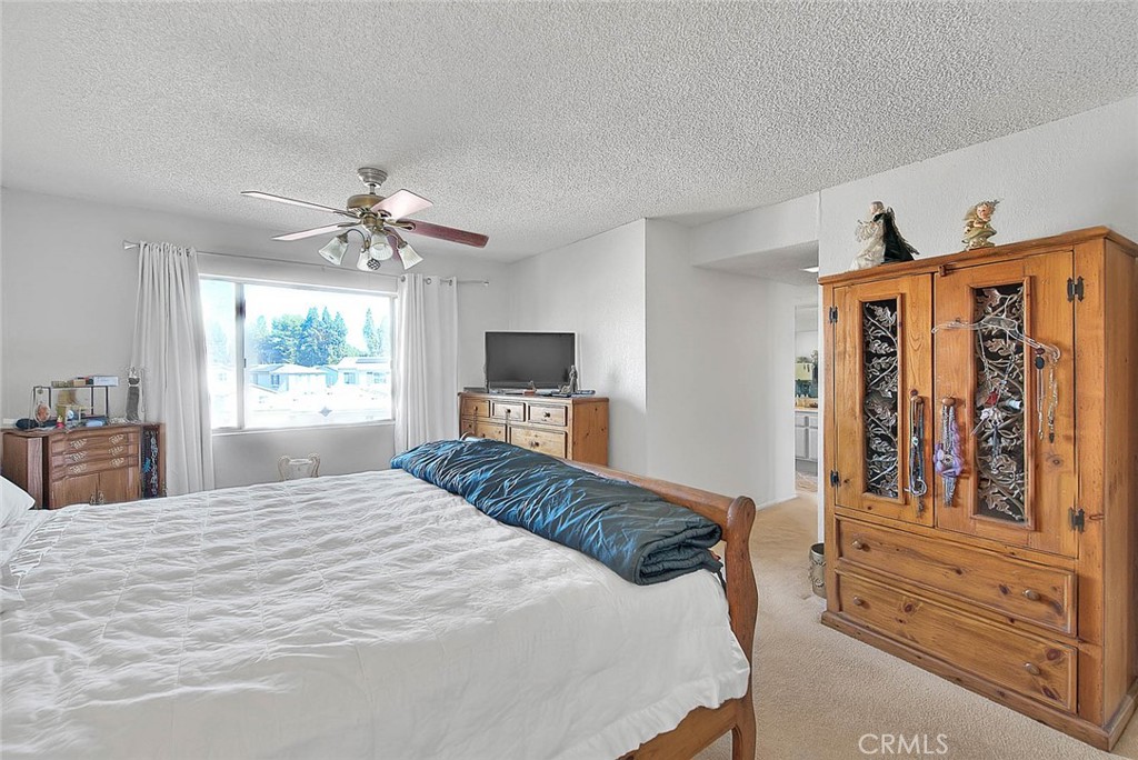 8 Tanglewood Drive Phillips Ranch, CA 91766 - Photo 39 of 71 a bedroom with a large bed and a window