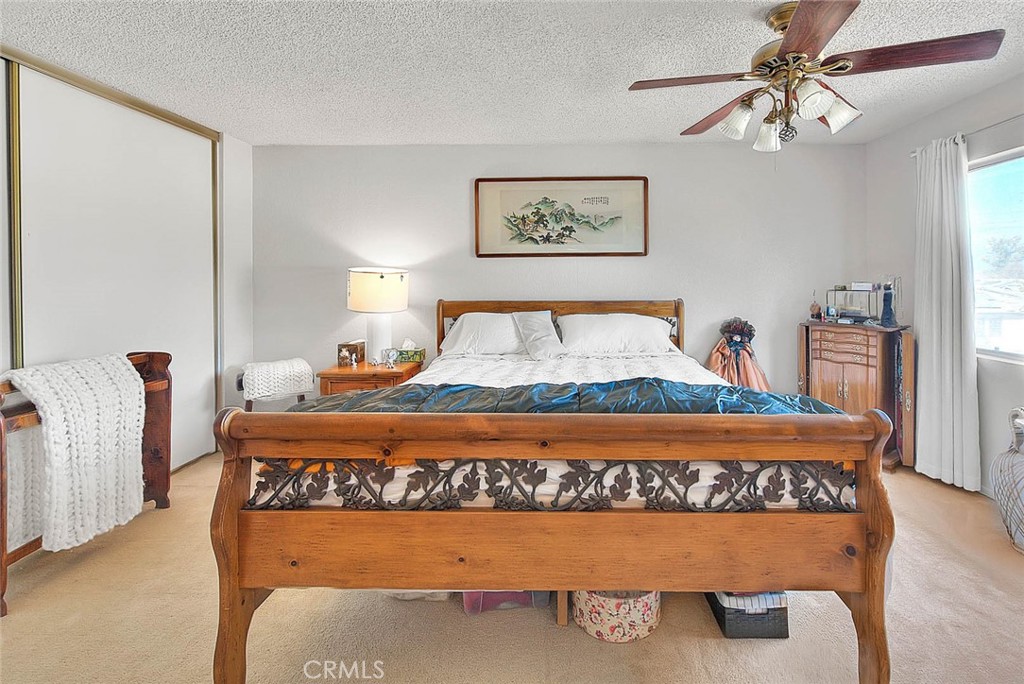 8 Tanglewood Drive Phillips Ranch, CA 91766 - Photo 40 of 71 a large bed sitting in a bedroom next to a window