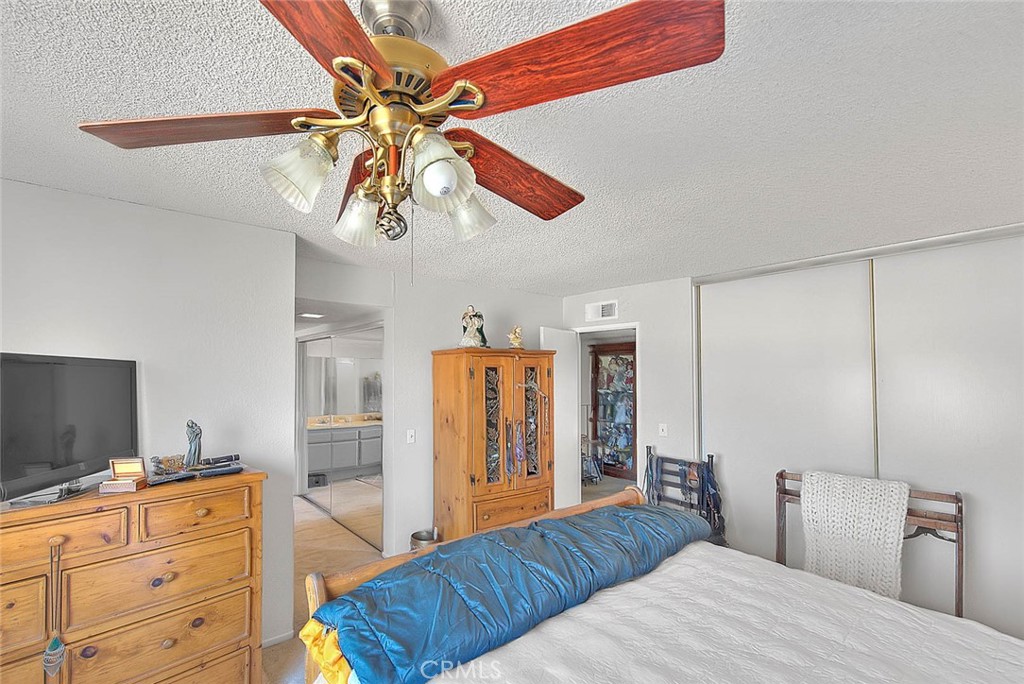 8 Tanglewood Drive Phillips Ranch, CA 91766 - Photo 41 of 71 a bedroom with a bed and a flat screen tv