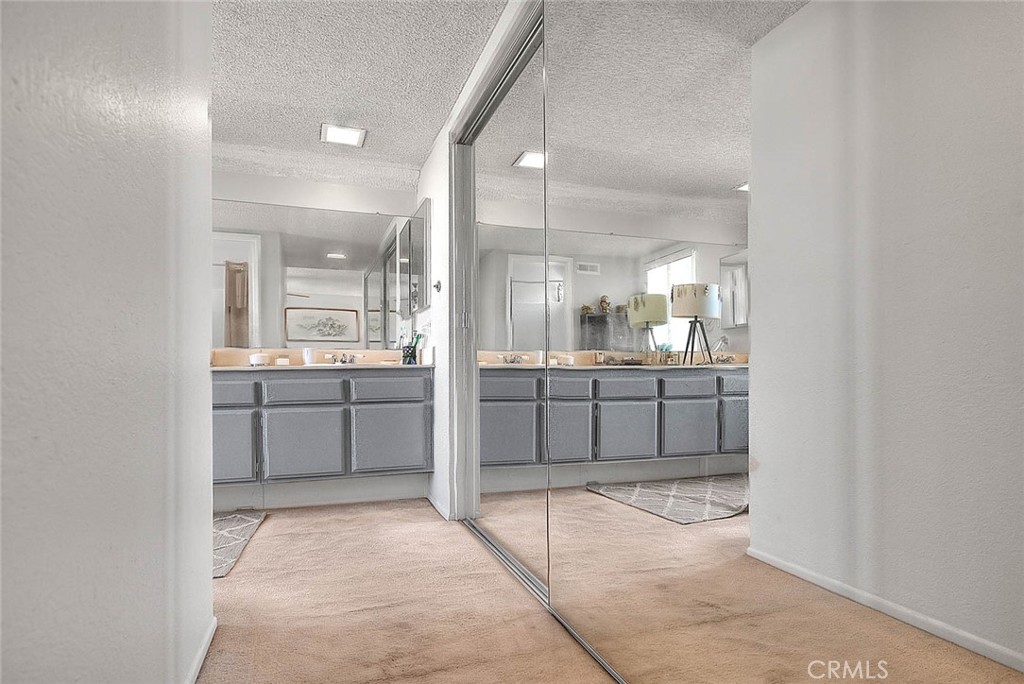 8 Tanglewood Drive Phillips Ranch, CA 91766 - Photo 45 of 71 a bathroom with a shower a sink a mirror and