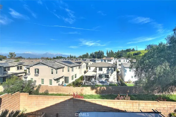 an aerial view of residential houses with outdoor space and street view