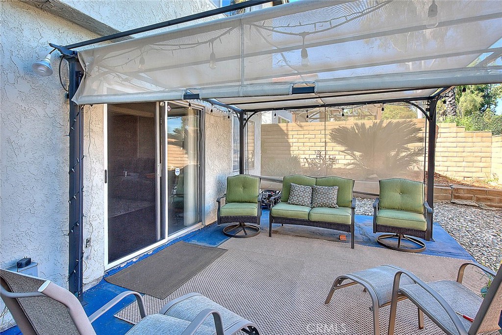 8 Tanglewood Drive Phillips Ranch, CA 91766 - Photo 50 of 71 a living room with furniture and a large window