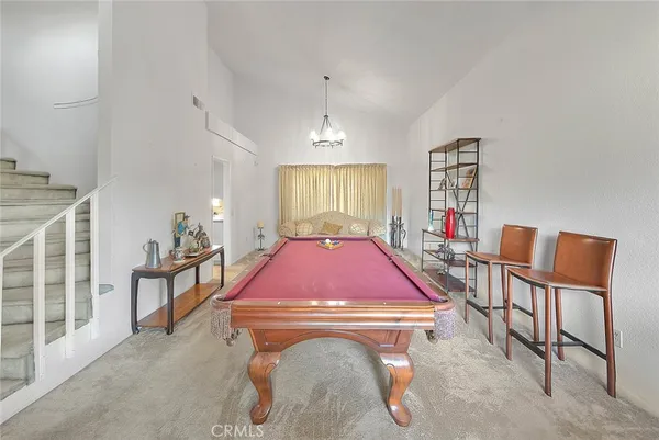 a living room with furniture window and wooden floor