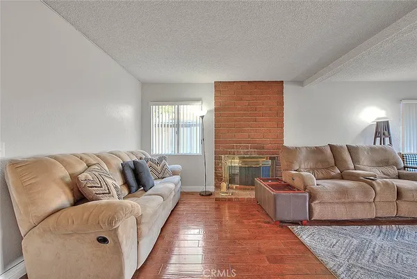 a living room with a couch and a fireplace