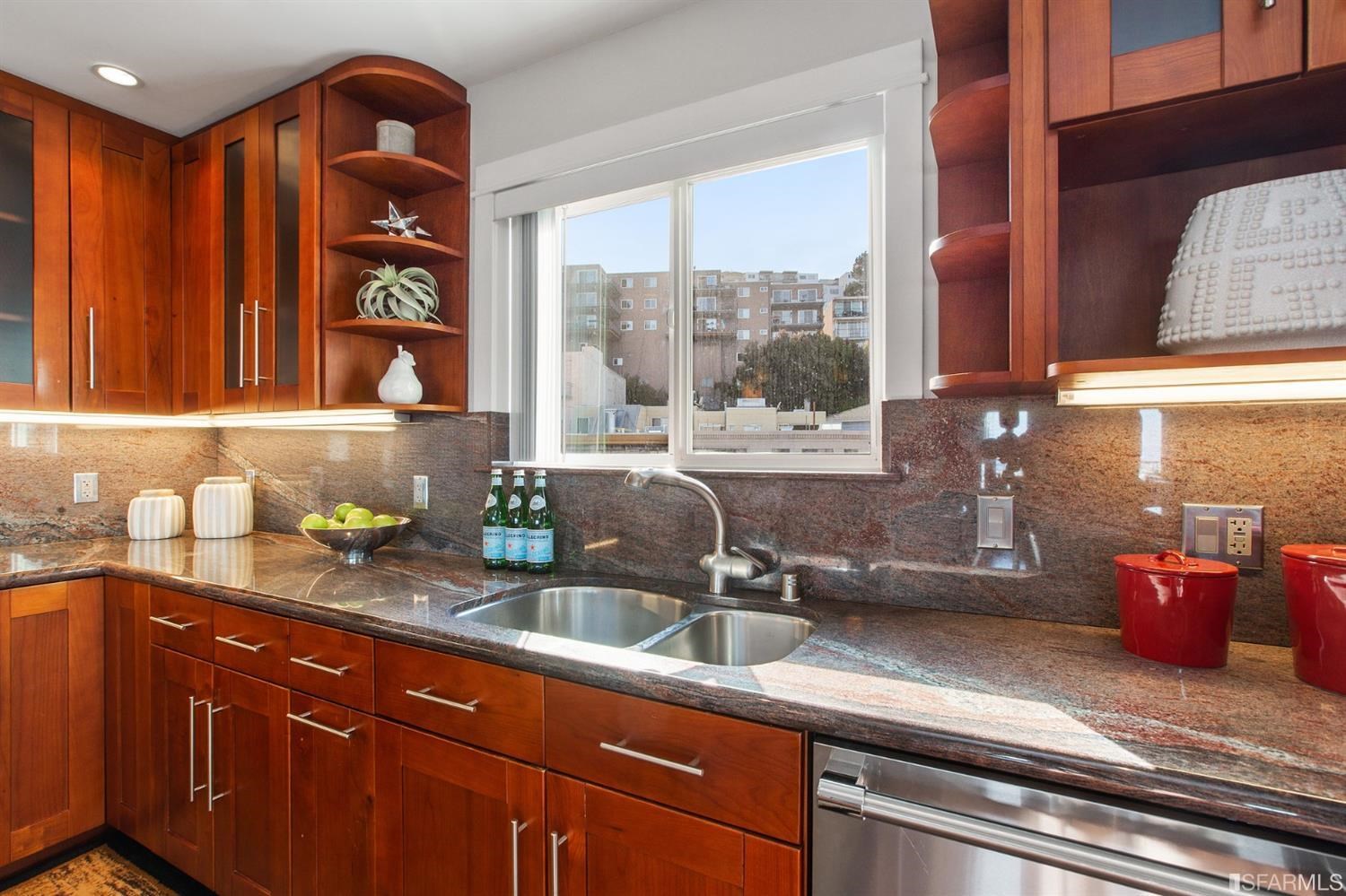 881 Corbett Avenue, Unit 3 San Francisco, CA 94131 - Photo 27 of 78 a kitchen with stainless steel appliances granite countertop a sink a stove and a granite counter tops with large windows