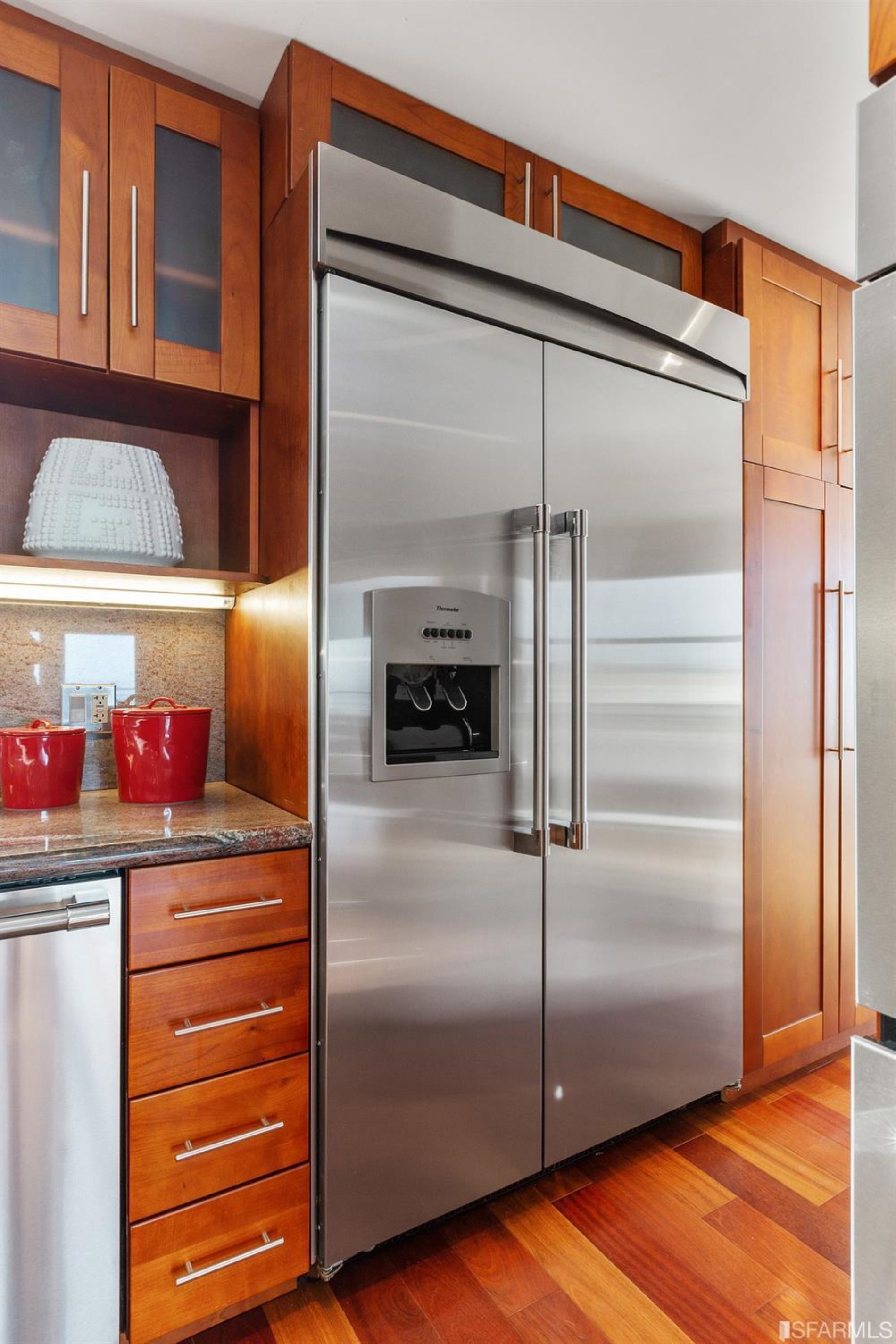 881 Corbett Avenue, Unit 3 San Francisco, CA 94131 - Photo 28 of 78 a kitchen with metallic refrigerator and cabinets