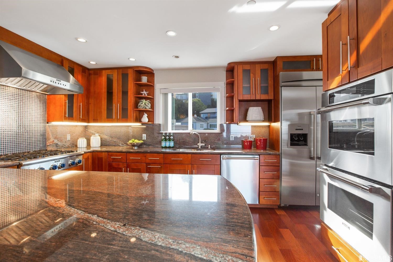 881 Corbett Avenue, Unit 3 San Francisco, CA 94131 - Photo 29 of 78 a large kitchen with stainless steel appliances granite countertop a stove and a sink