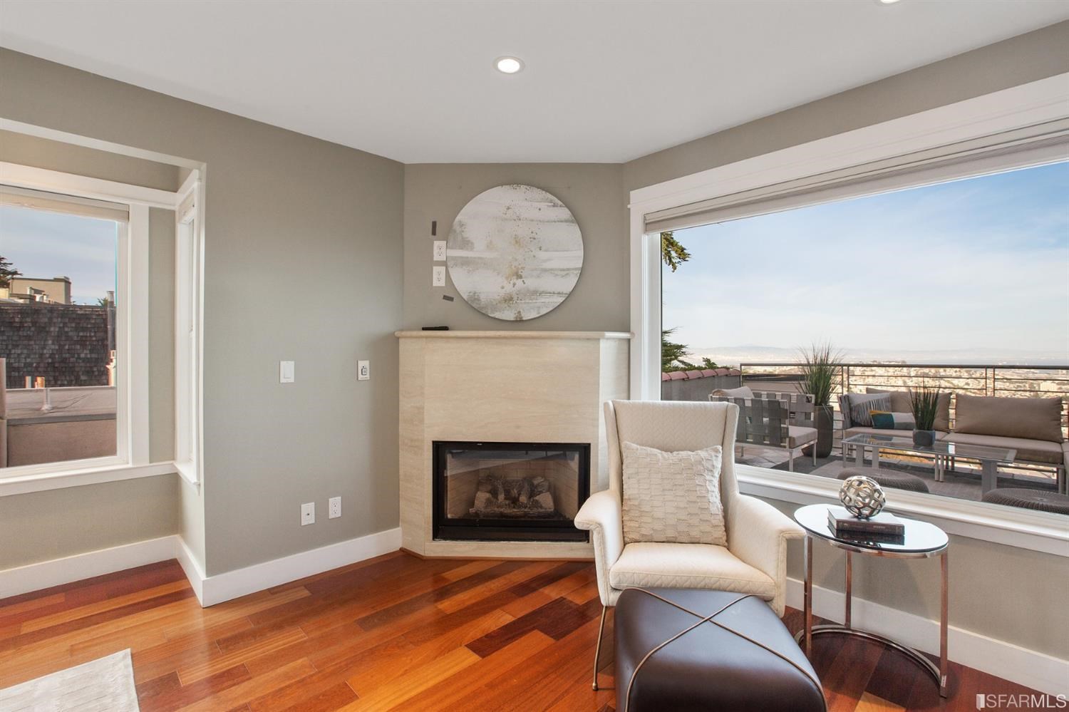 881 Corbett Avenue, Unit 3 San Francisco, CA 94131 - Photo 39 of 78 a living room with furniture a fireplace and a large window