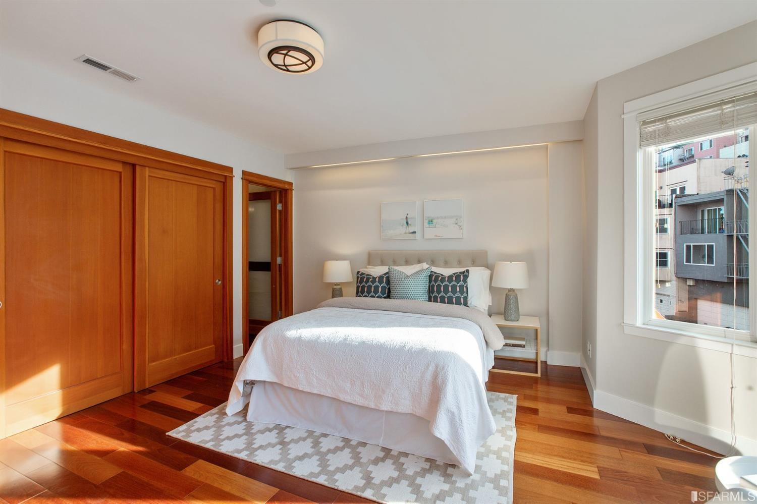 881 Corbett Avenue, Unit 3 San Francisco, CA 94131 - Photo 42 of 78 a bedroom with a bed and a window