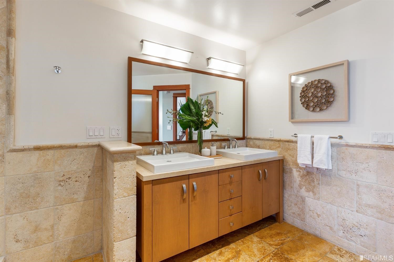881 Corbett Avenue, Unit 3 San Francisco, CA 94131 - Photo 46 of 78 a bathroom with a sink and a mirror
