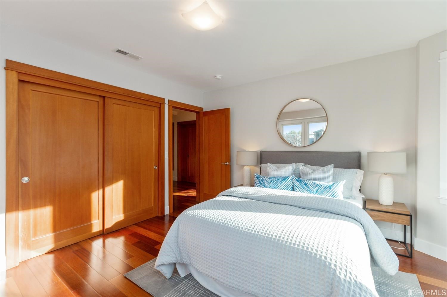 881 Corbett Avenue, Unit 3 San Francisco, CA 94131 - Photo 56 of 78 a bedroom with a large bed and wooden floor