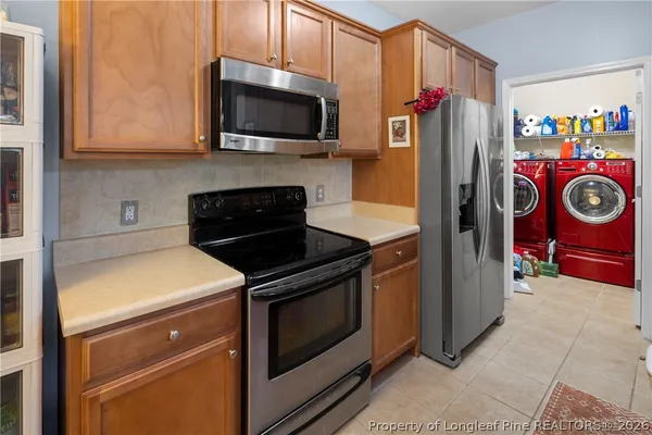 a bathroom with a sink a large mirror and a bathtub