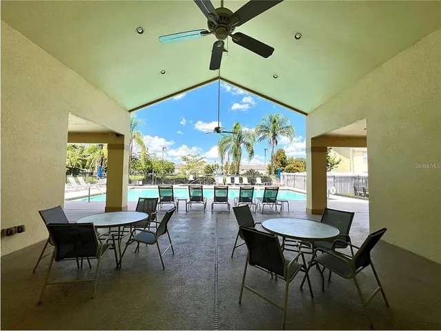 a view of a dining room with furniture and window