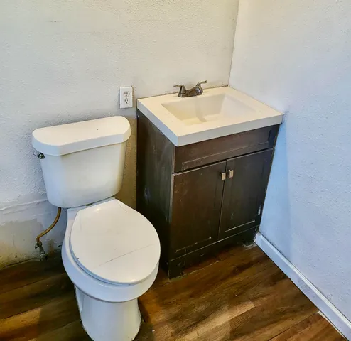 a bathroom with a toilet and a sink