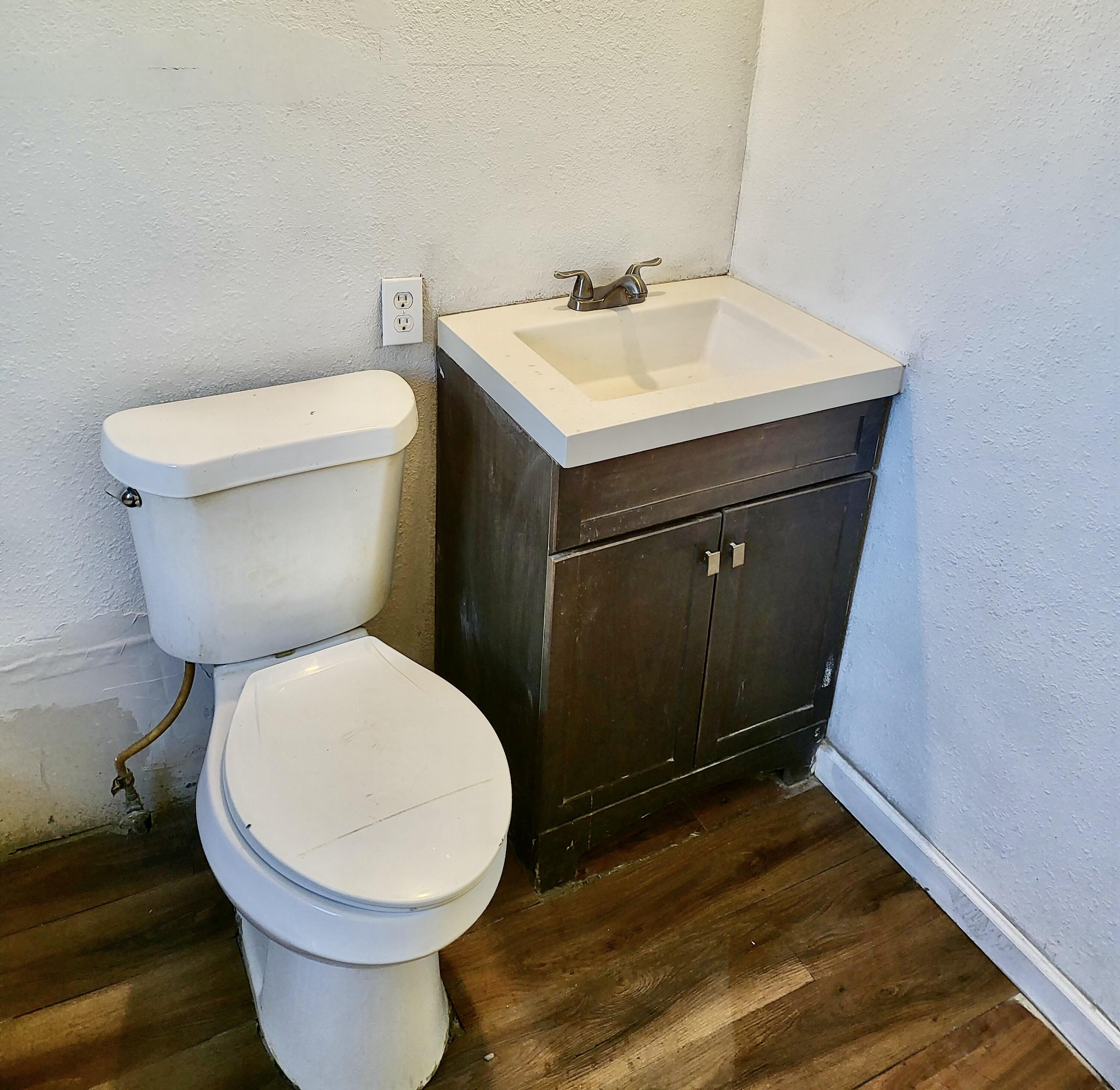 2824 Bates Street Lubbock, TX 79415 - Photo 15 of 19 a bathroom with a toilet and a sink