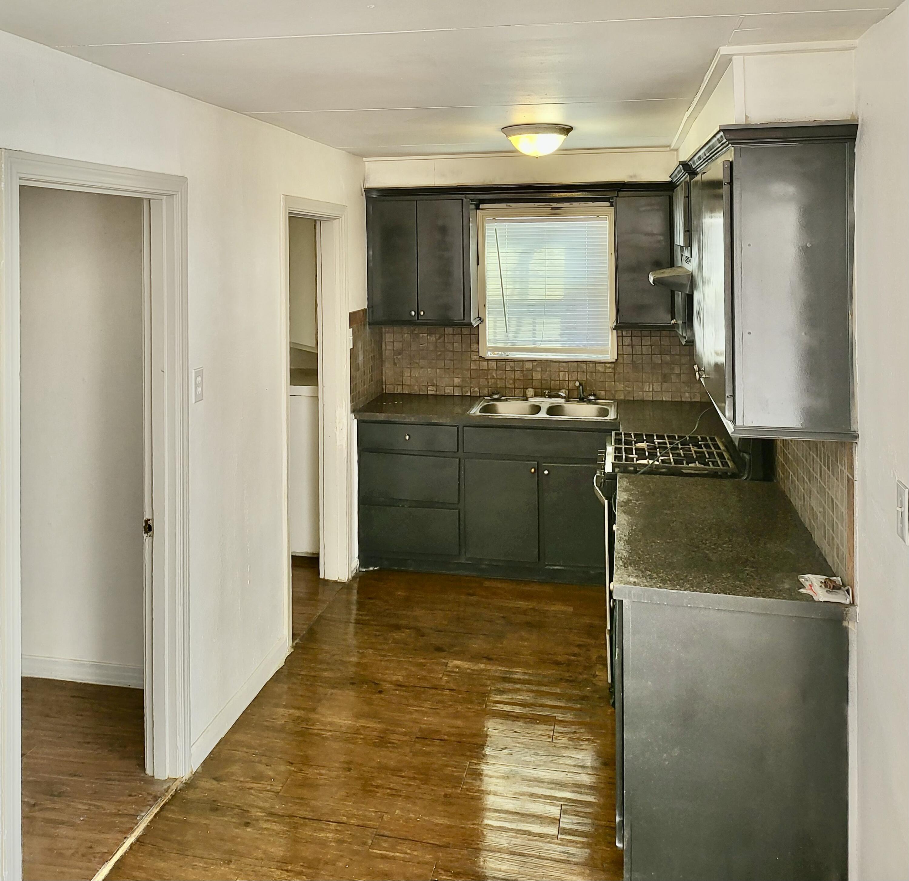 2824 Bates Street Lubbock, TX 79415 - Photo 17 of 19 a kitchen with stainless steel appliances granite countertop a refrigerator and a stove