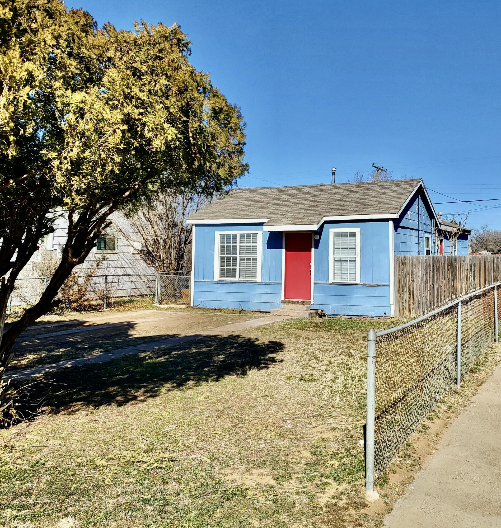 2824 Bates Street Lubbock, TX 79415 - Photo 2 of 19 a view of a house with a yard covered with snow in the background