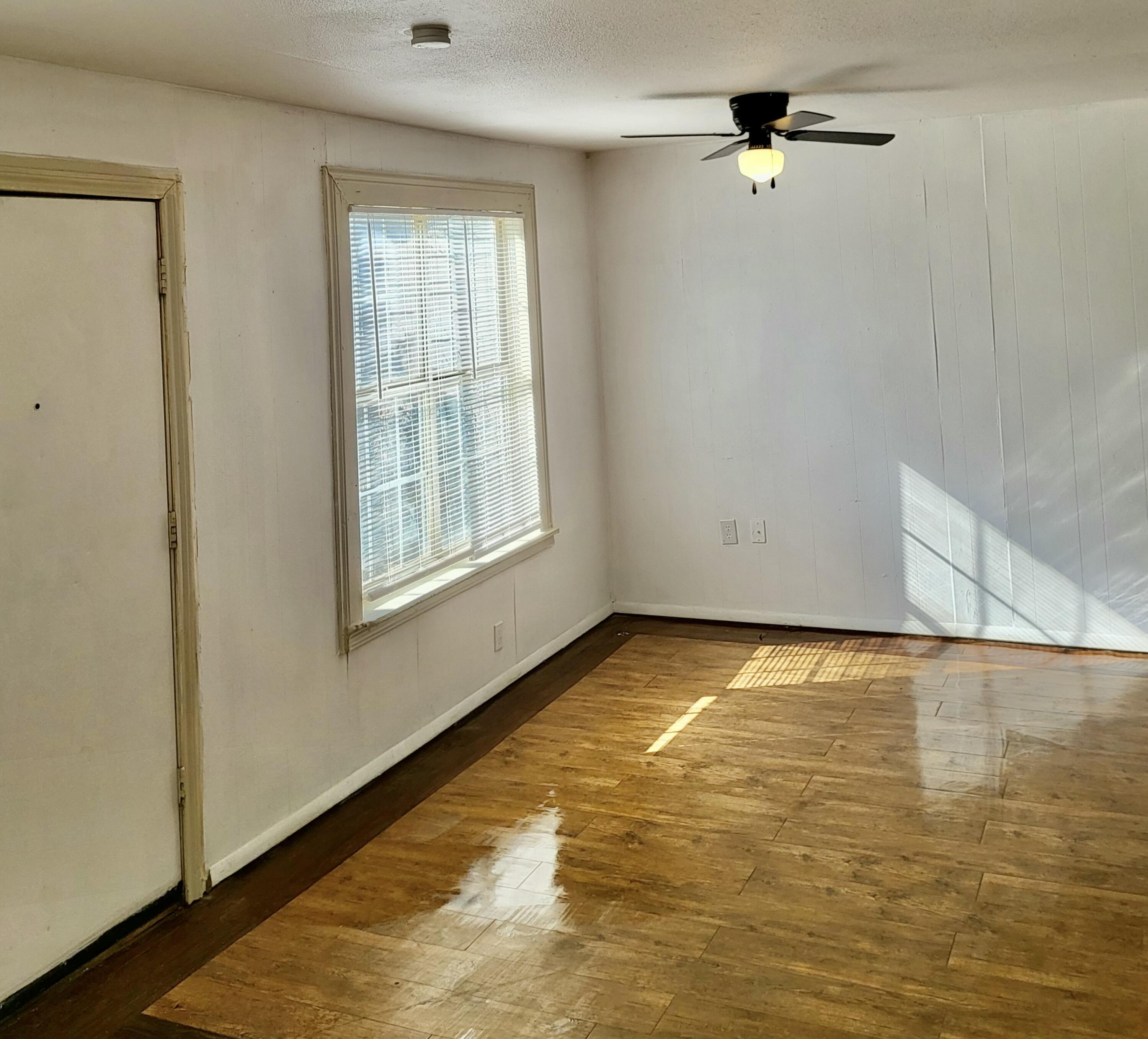 2824 Bates Street Lubbock, TX 79415 - Photo 7 of 19 a view of an empty room and window