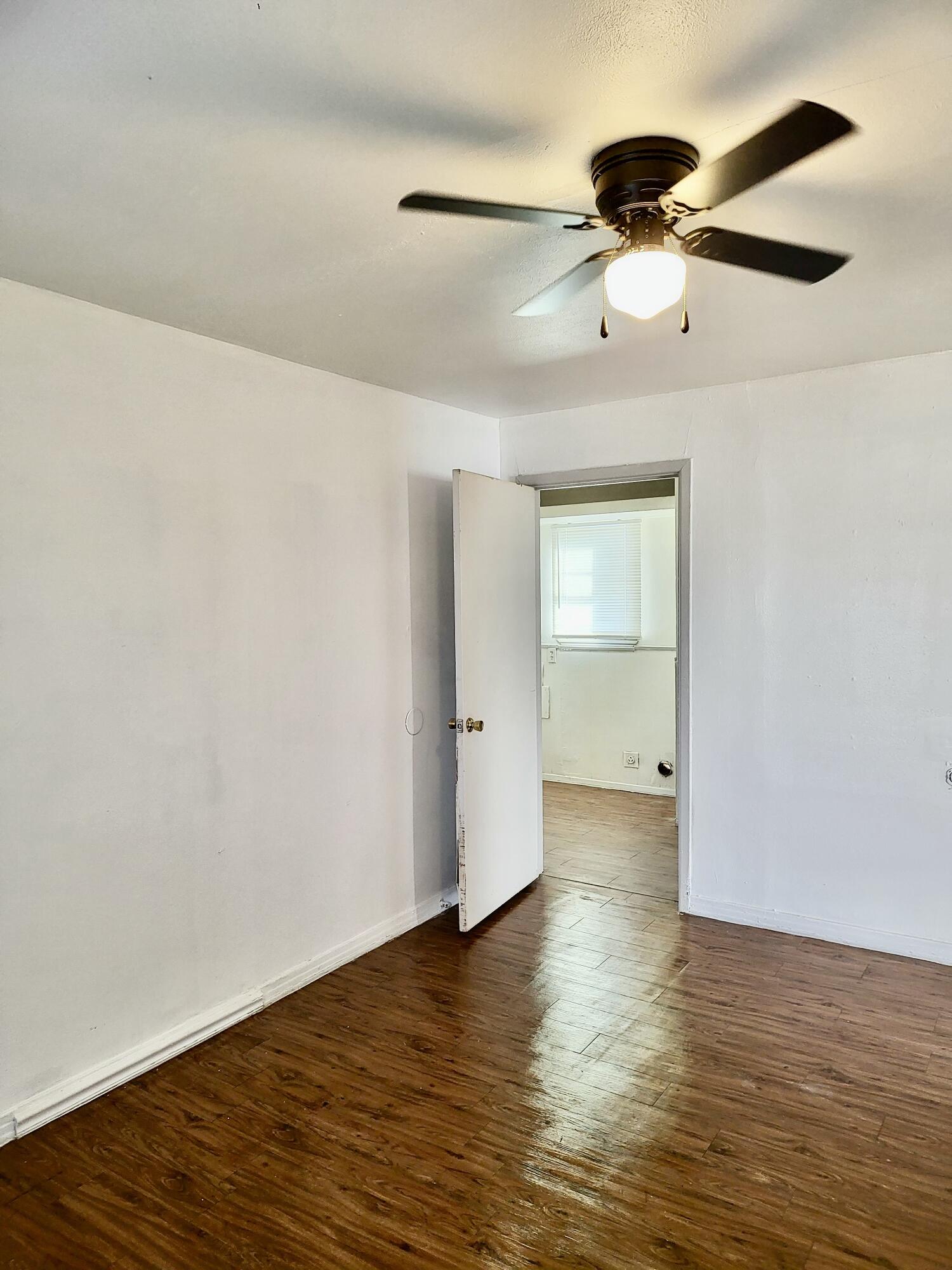 2824 Bates Street Lubbock, TX 79415 - Photo 9 of 19 wooden floor in an empty room