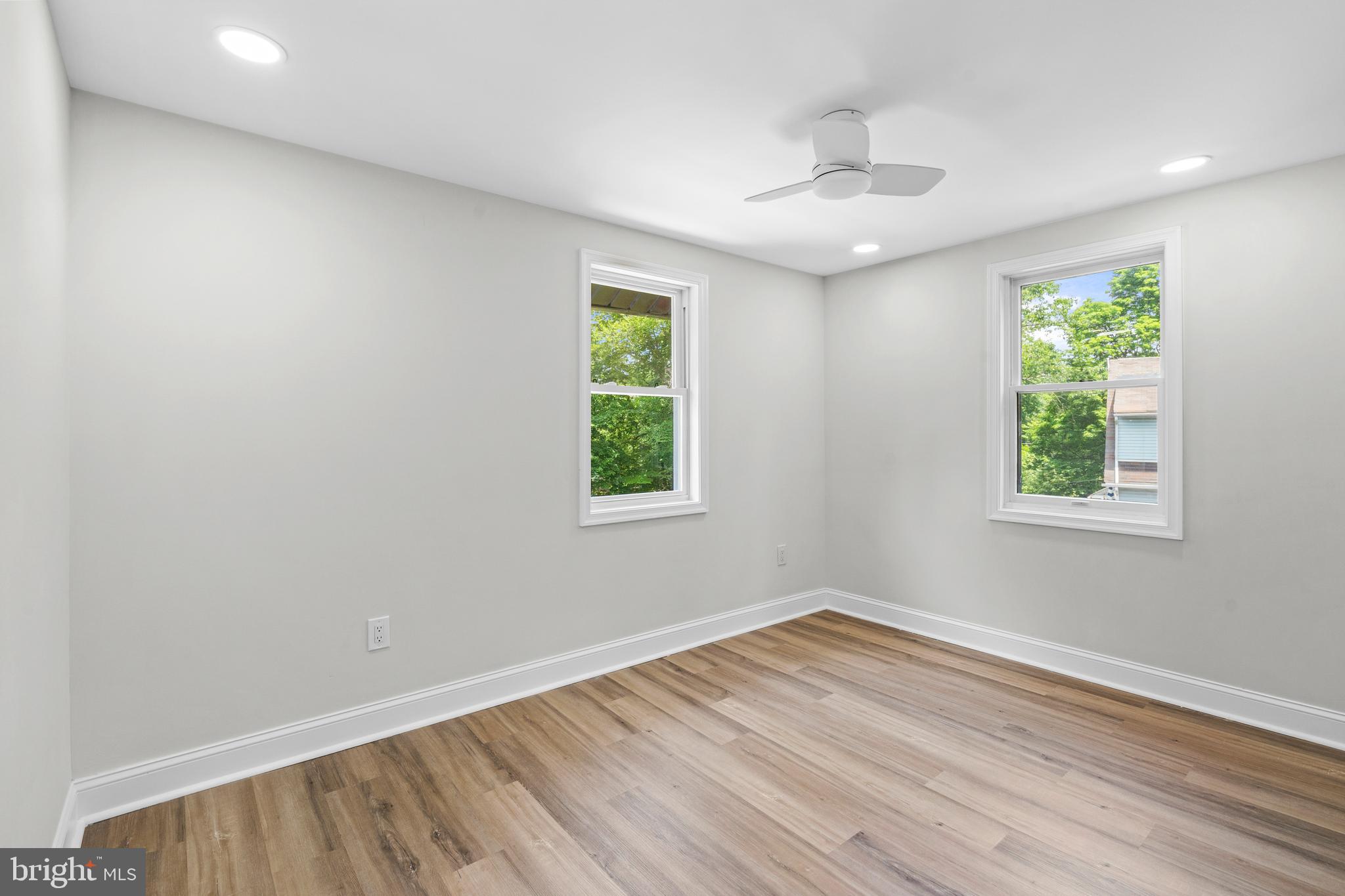 1082 Edge Hill Road Abington, PA 19001 - Photo 30 of 37 an empty room with wooden floor and windows