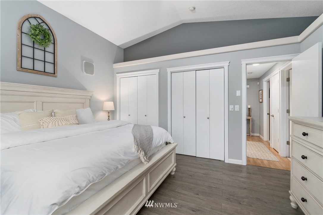 2111 Grove Street Longview, WA 98632 - Photo 16 of 26 a spacious bedroom with a bed and a dresser