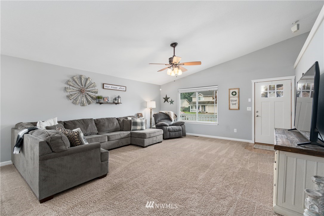 2111 Grove Street Longview, WA 98632 - Photo 5 of 26 a living room with furniture and a flat screen tv