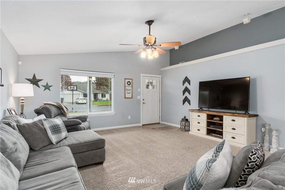 2111 Grove Street Longview, WA 98632 - Photo 6 of 26 a living room with furniture and a flat screen tv
