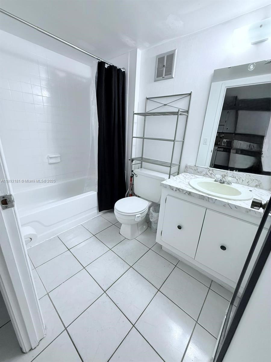 300 Northwest 42nd Avenue, Unit 109 Miami, FL 33126 - Photo 13 of 18 a bathroom with a sink and a mirror
