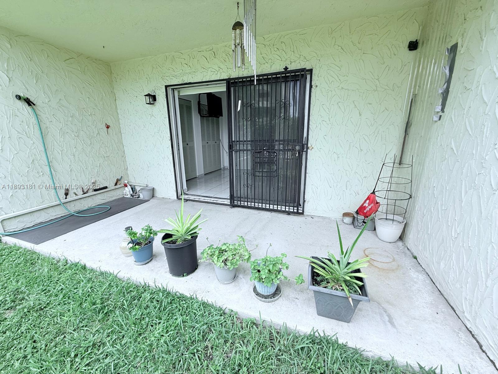 300 Northwest 42nd Avenue, Unit 109 Miami, FL 33126 - Photo 15 of 18 a white vase with flowers