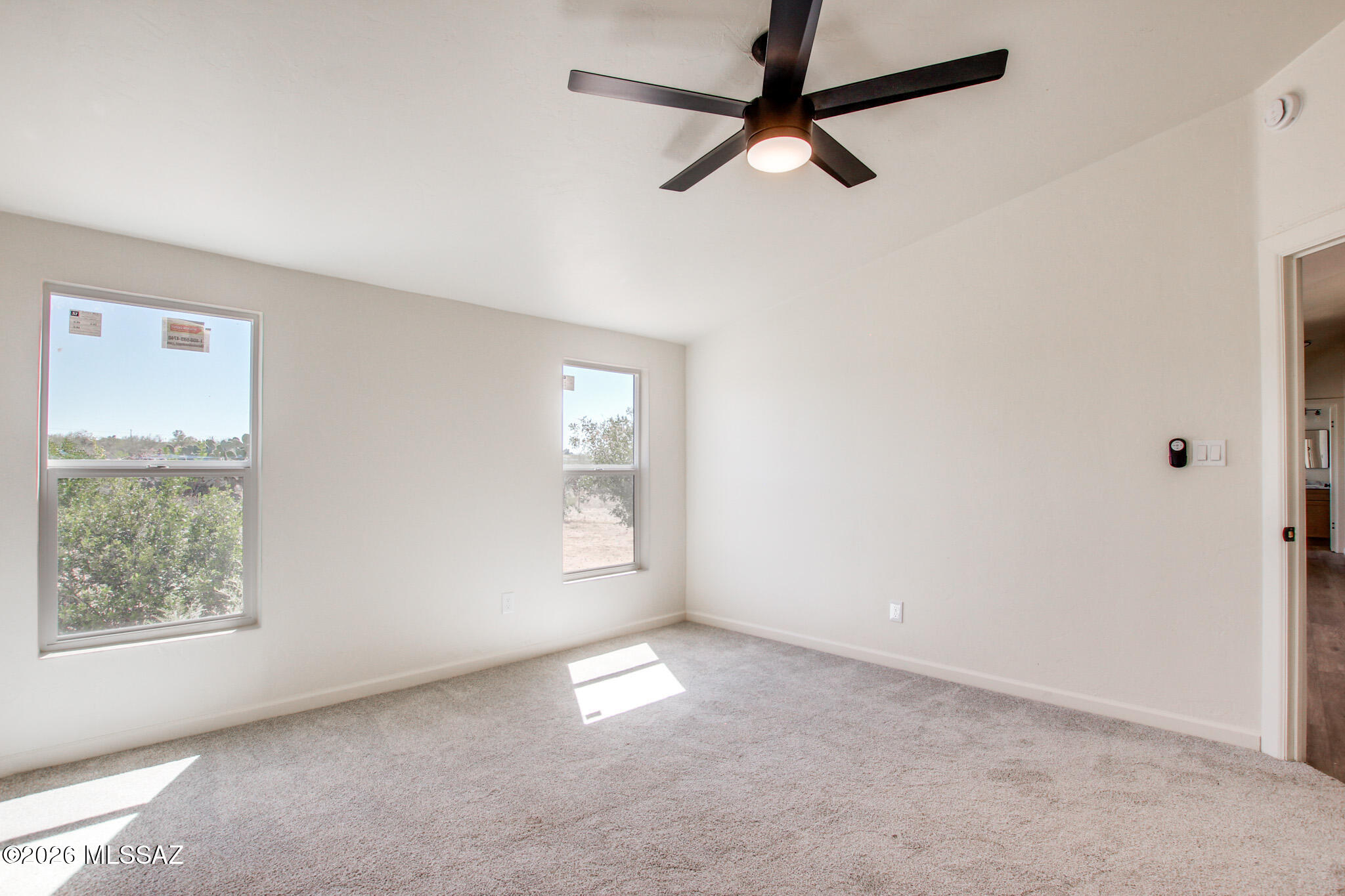 14303 West Rolina Lane Tucson, AZ 85736 - Photo 24 of 38 an empty room with windows and fan view