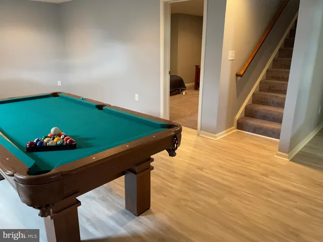 a room with lots of flowers and stairs