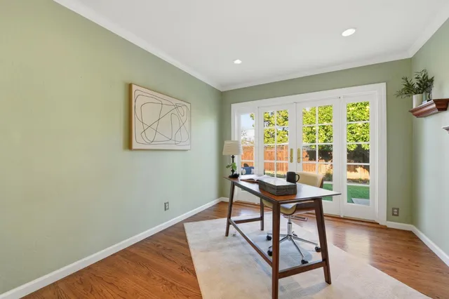 a dining room with furniture and window
