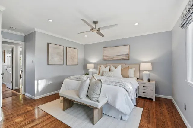 a bedroom with a bed and a night stand