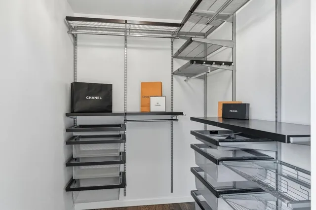 a view of storage and utility room with two washing machine