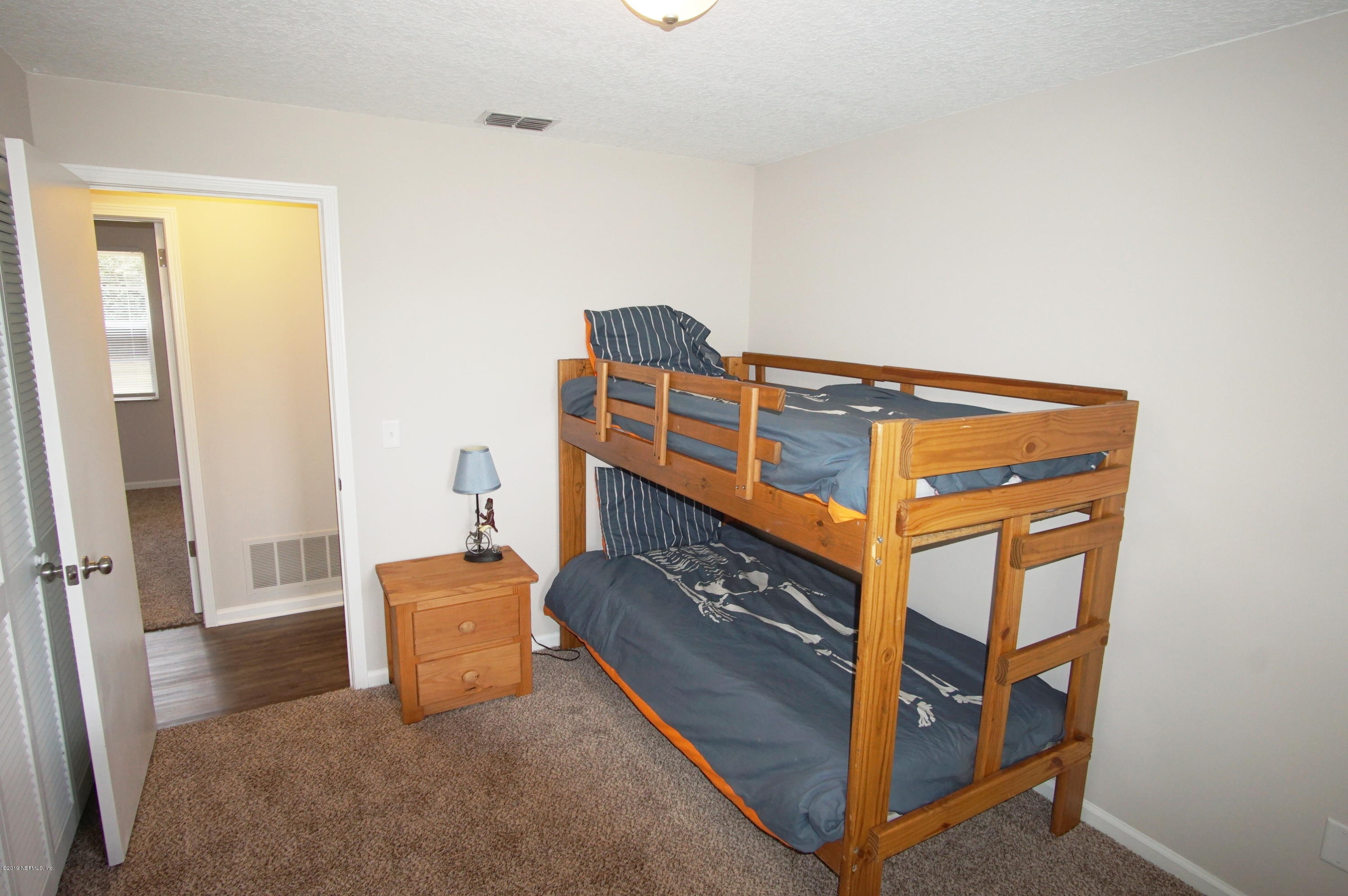 8232 Blazing Star Road Jacksonville, FL 32210 - Photo 17 of 23 Guest Bedroom