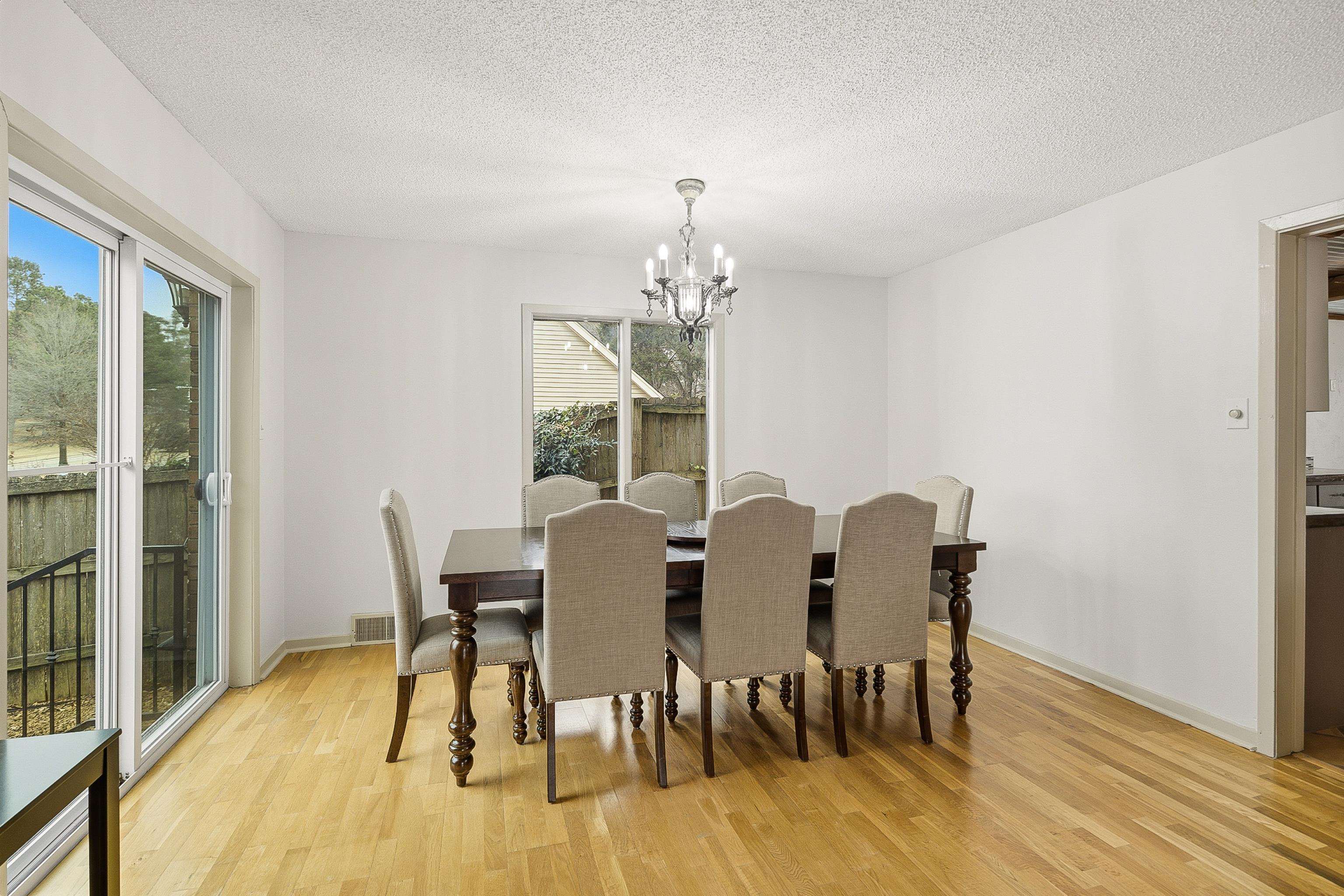 1833 New Riverdale Road Germantown, TN 38138 - Photo 11 of 40 a view of a dining room with furniture and wooden floor